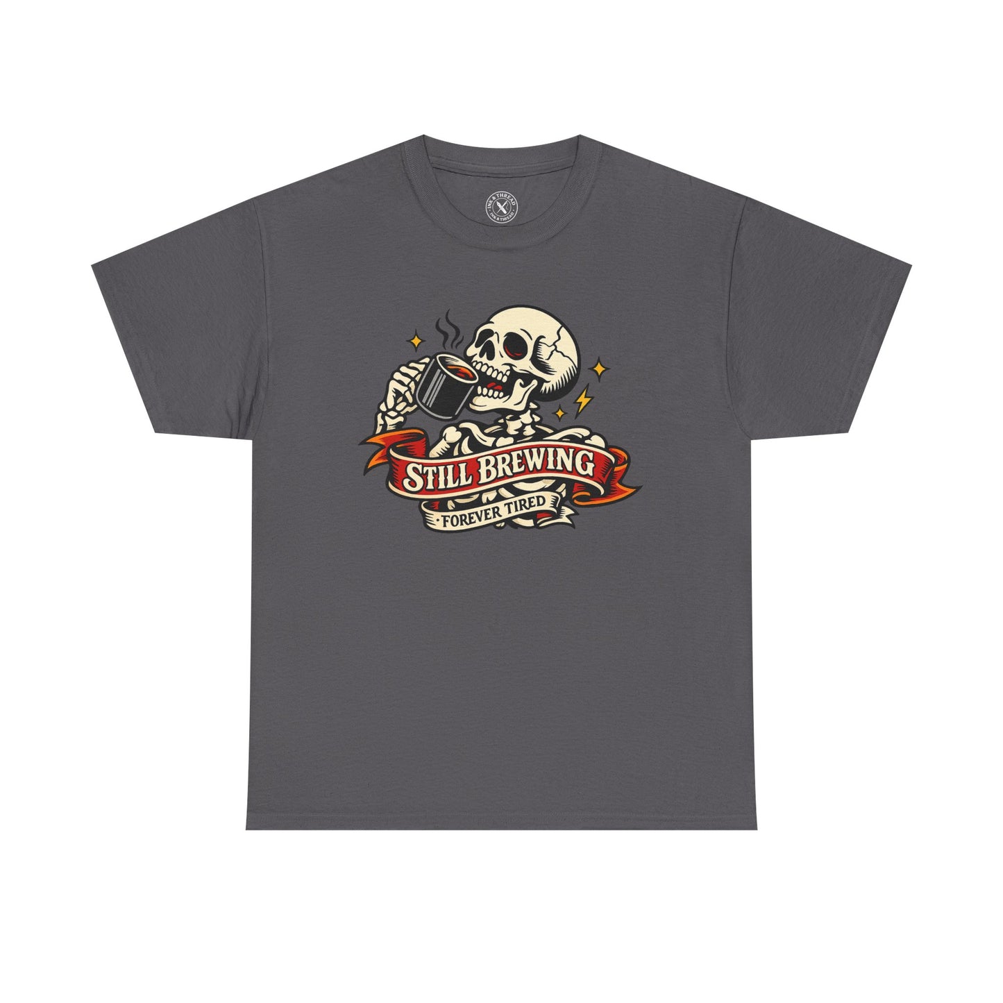 Charcoal grey t-shirt with a skull and coffee cup graphic and Still Brewing Forever Tired text on a white background